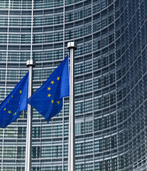 EU flags outside a large building