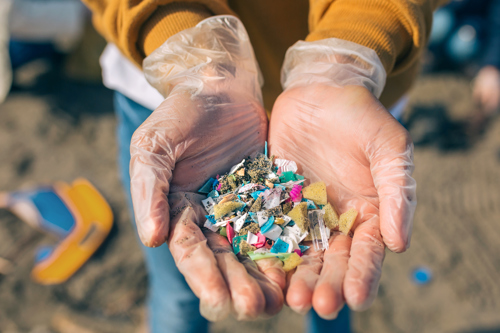 Hands holding plastic